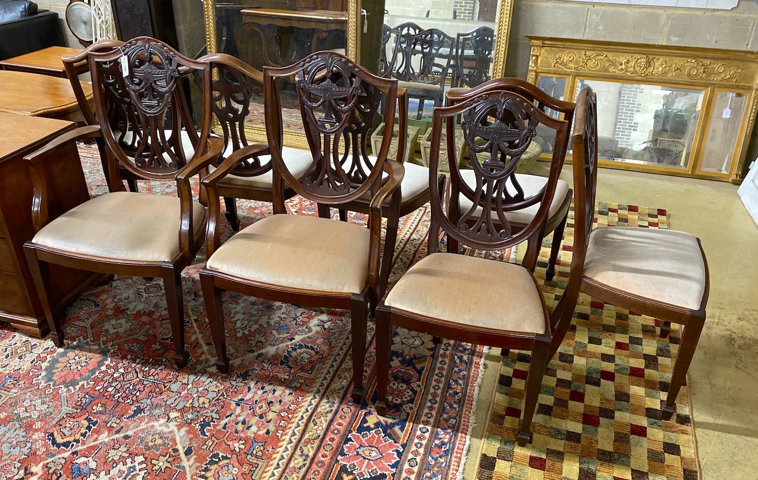 A set of eight early 20th century Hepplewhite style mahogany dining chairs (two with arms)
